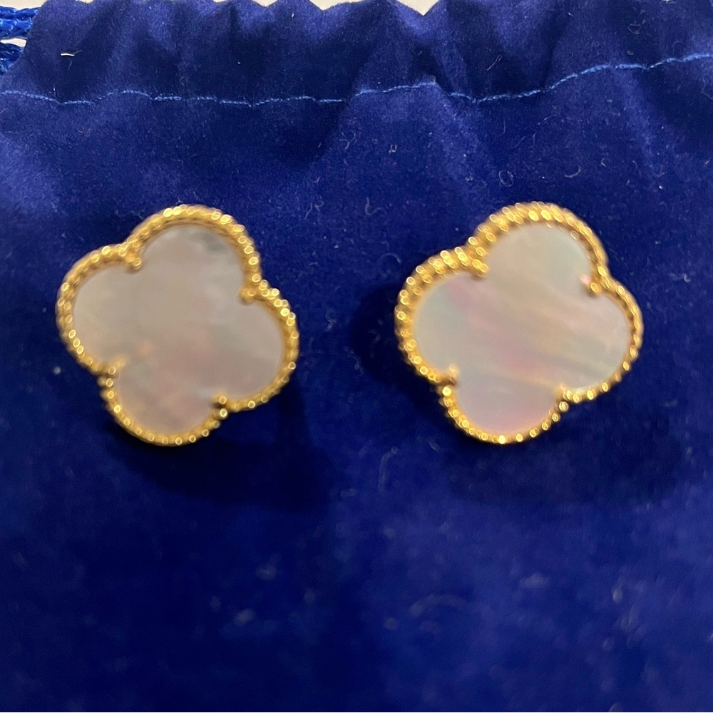 New pierced earrings, never worn. Style similar to Van Cleef Alhambra.